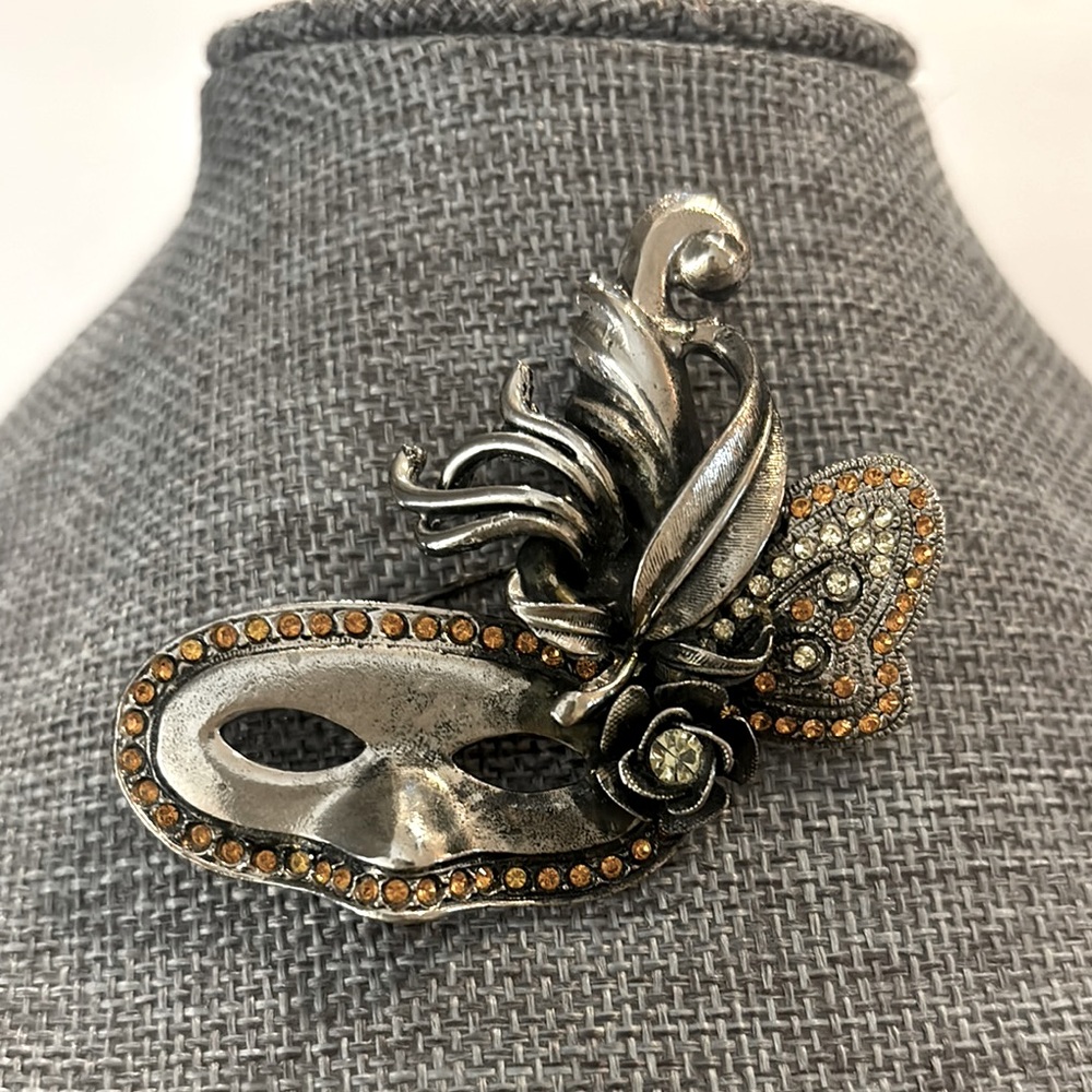 Vintage Danny Pollak mask silver tone with stones brooch